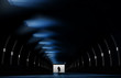© ViewBug - Silhouette of person standing at end of tunnel