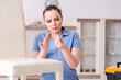 © Elnur - Young woman repairing chair at home