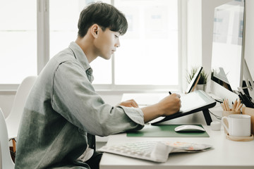 Graphic designers work together with computer designing application for mobile phone, Graphic designers concept
