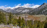Fototapeta Na ścianę - Spring at Rocky Mountain National Park - A panoramic view of Rocky Mountain National Park on a sunny morning after a Spring snowstorm, with snow-capped Mummy Range towering in background, Colorado, US