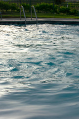 empty pool with blue water on the morning
