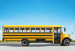 School bus parked on the road, concept of going back to school, beautiful sunny day, 3d rendering