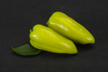 Green bell pepper over wooden background