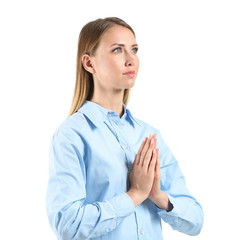Wall Mural - Religious young woman praying on white background
