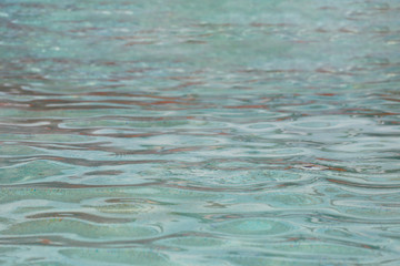 Wave of water in the pool.