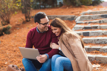 Couple using laptop