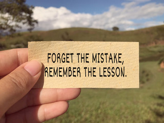 Wall Mural - Motivational and inspirational wording - Forget The Mistake, Remember The Lesson. Blurred styled background.