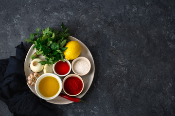 Poster - Ingredients for cooking Argentinian green Chimichurri or Chimmichurri salsa or sauce top view