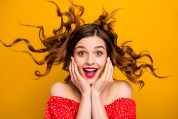 Wall Mural - Pretty lady enjoy warm spring breeze making curly hairstyle flight wear red dress isolated yellow background