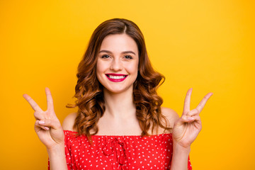 Poster - Photo of nice foxy lady hands showing v-sign symbol wear red dress with open shoulders isolated yellow background