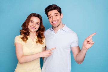 Poster - Portrait of his he her she nice attractive cheerful cheery confident people pointing aside ad advert solution isolated over bright vivid shine blue green background