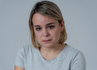 © SB Arts Media - Portrait of sad and intimidated woman. Isolated in white background. Human expressions and emotions