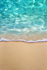 soft blue ocean wave or clear sea on clean sandy beach summer concept
