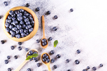 Wall Mural - Perfectly ripe freshly picked local produce blueberries. Close up, copy space for text, top view, background. Healthy vegan snacks full of antioxidants. Seasonal summer berries.