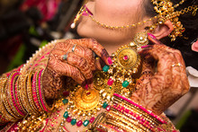 Indian Bride Wearing Heavy Jewellery Traditional Gold Necklace And Earring , Wedding Day, Background 