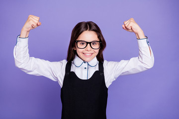 Poster - Close-up portrait of nice attractive lovely cheerful cheery funny wavy-haired pre-teen girl showing muscles knowledge isolated over bright vivid shine violet background