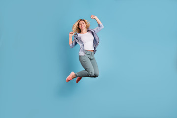 Poster - Full body photo of pretty lady raising arms wearing pants trousers isolated over blue background