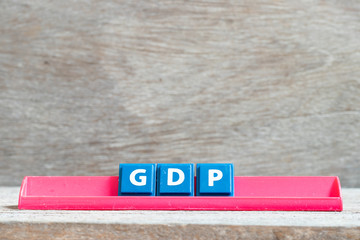 Sticker - Tile letter on red rack in word GDP (Abbreviation of good distribution practice or gross domestic product) on wood background