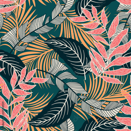 Materiał do szycia Trend seamless pattern with colorful tropical leaves and plants on green background. Vector design. Jungle print. Flowers background. Printing and textiles. Exotic tropics. Fresh design.