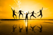 © shahrilkhmd - Silhouette of friends jumping over sun rising up