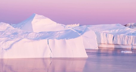 Wall Mural - climate change. iceberg and ice from glacier in arctic nature landscape on greenland. aerial video d