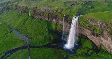 Wall Mural - iceland aerial drone 4k video of waterfall seljalandsfoss in icelandic nature. famous tourist attrac