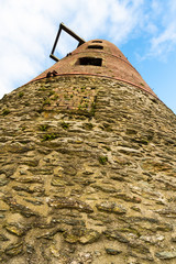 Derelict windmill, looking up, portrait