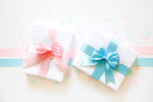 A Gift For A Boy And A Girl At The Same Time. Surprise. Satin Ribbon In Blue And Pink.