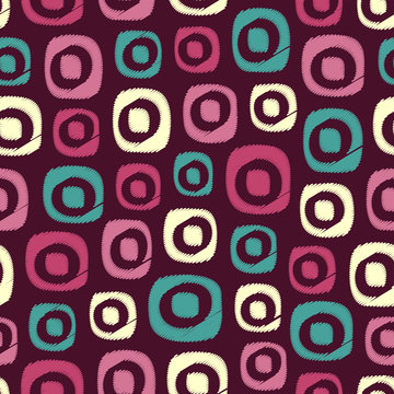 Seamless abstract pattern in scribble style with the image of oval geometric shapes.