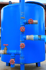 Water filter System. Blue metal water tank.