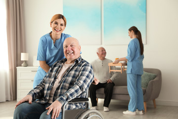 Poster - Nurses assisting elderly people at retirement home