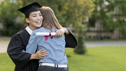 Wall Mural - Young students celebrating their graduation