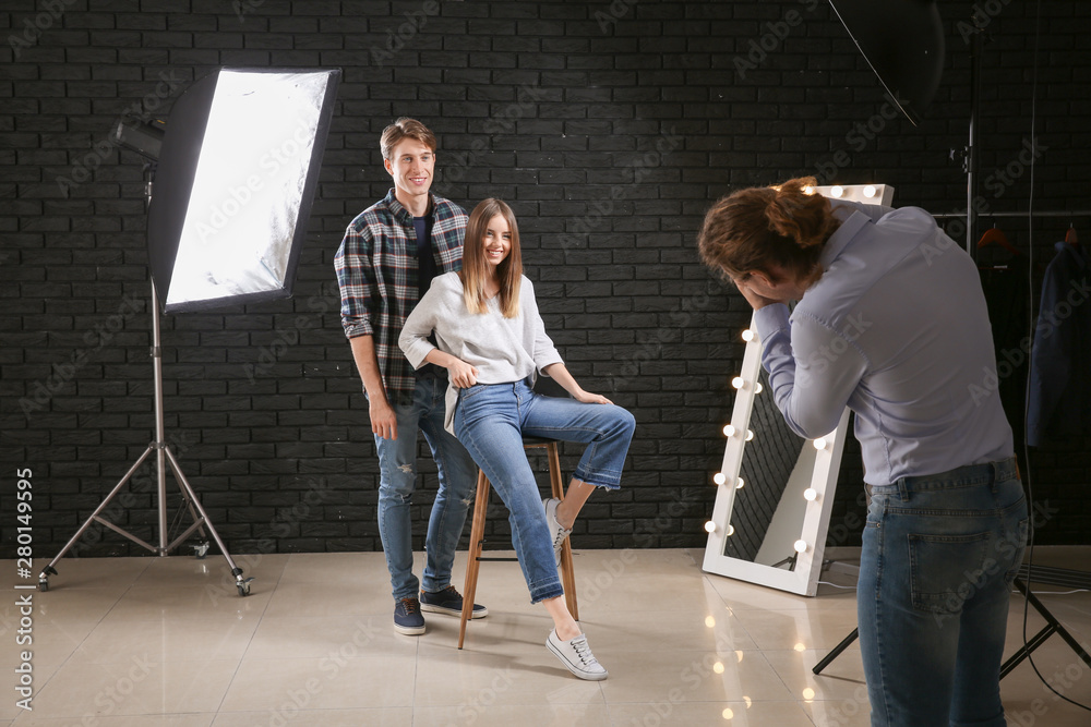 Professional photographer working with models in studio