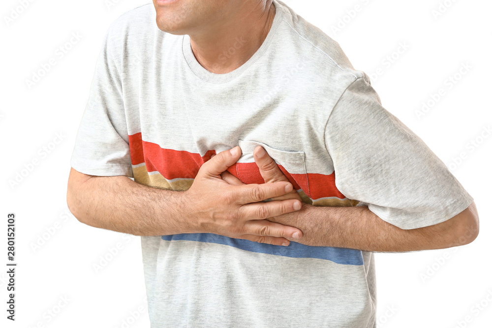 Mature man suffering from heart attack on white background, closeup