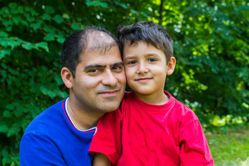 Wall Mural - portrait of dad and son outdoors