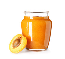 Glass Jar Of Tasty Apricot Jam On White Background