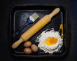 ETAL TRAY WITH EGGS, FLOUR, WOOD ROLLER AND KITCHEN BRUSH
