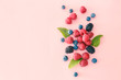 Sweet ripe berries on color background