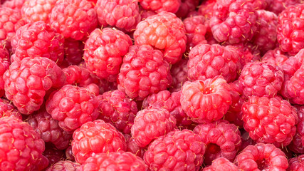 Red ripe strawberry berries closeup. Macro photo of raspberry, red berry background