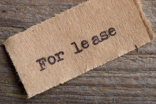 For lease typed text on a paper, real estate concept
