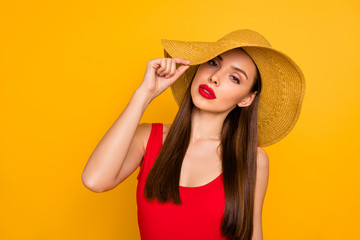 Poster - Close-up portrait of her she nice attractive glamorous lovely lovable charming cute gorgeous winsome straight-haired lady touching hat isolated on bright vivid shine yellow background