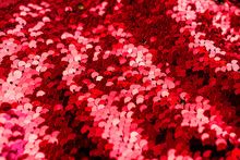 Background Of Red Sequin. Fashion Shiny Fabric. Scales Of Round Sequins. Festive Abstract Glittery Background.