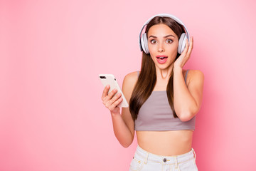 Poster - Portrait of impressed lady with opened mouth having stupor holding device isolated over pink background