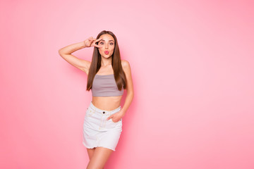 Poster - Portrait of her she nice-looking lovely girlish charming cute pretty cheerful cheery funny straight-haired lady showing v-sign near eye sending kiss posing isolated over pink pastel background