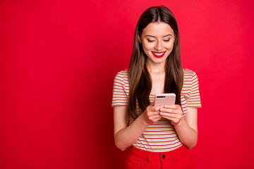 Wall Mural - photo of pretty nice cheerful friendly kind teenager donwloading app from official page site on the 