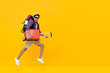 © Atstock Productions - Handsome Indian tourist man with backpack holding baggage and jumping
