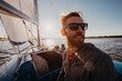 © romankosolapov - Adult man on marina sport boat portrait happy relaxed on a sunset