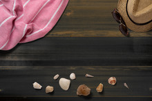 Towel. Scarf. Cover For Picnic. Straw Hat. Sunglasses. Seashells. Summer Travel Concept Elements. On Vintage Dark Wooden Table. Top View.