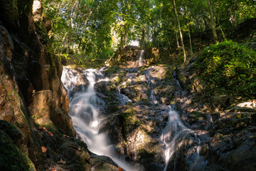 Wall Mural - Ton Sai Waterfall in the tropical forest area In Asia, suitable for walks, nature walks and hiking, adventure photography Of the national park Phuket Thailand.