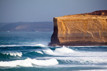 The Sheer Cliffs Of Broken Head And A Surging Southern Ocean Along Australia's Famous Great Ocean Road.